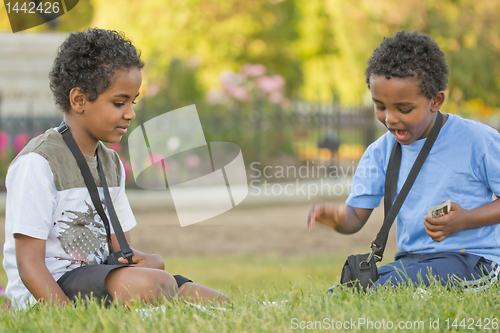Image of kids playing cards