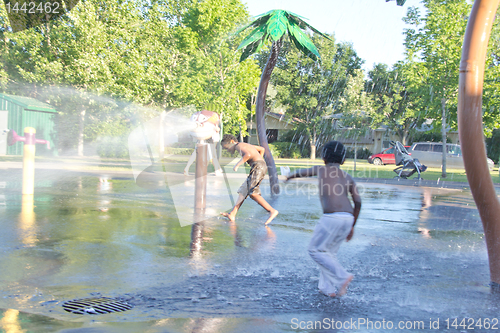 Image of Kids playing in a water splash park