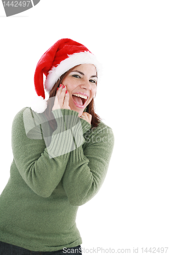 Image of surprised christmas woman wearing a santa hat smiling isolated o