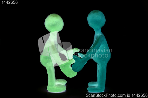 Image of Shaded plasticine puppets standing opposite each other