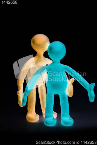 Image of Shaded plasticine puppets standing on black background