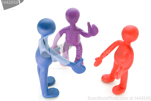 Image of Colored plasticine puppets talking on white background