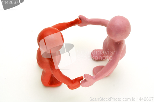 Image of Pair of plasticine puppets on white background