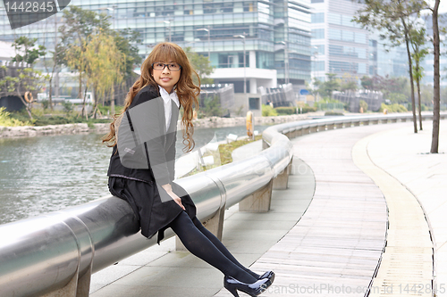 Image of asia business woman sitting outdoor