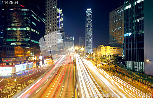 Image of Colorful city night with lights of cars motion blurred in hong k