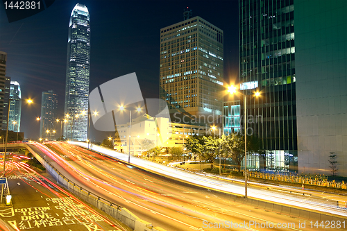 Image of Colorful city night with lights of cars motion blurred in hong k