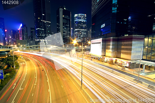 Image of Colorful city night with lights of cars motion blurred in hong k