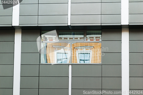 Image of Reflection of the ancient house in windows modern  in Riga