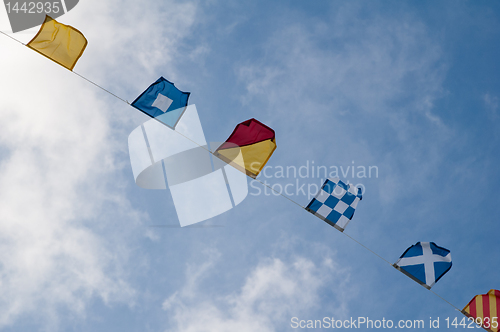 Image of Alarm ship tags .sea ship flags and blue sky