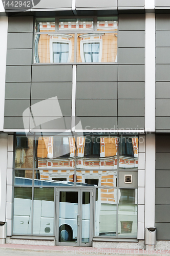 Image of Reflection of the ancient house in windows modern  in Riga