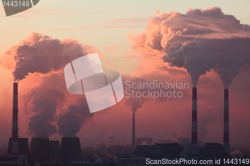 Image of Tube with smoke on winter sunset