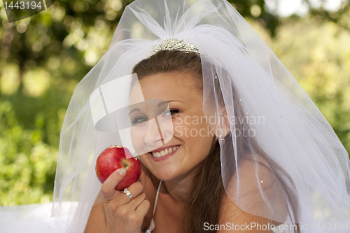 Image of Bride with apple