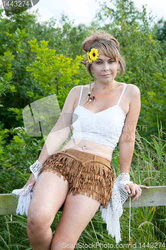 Image of sitting on a fence