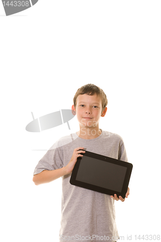 Image of young boy holding tablet computer