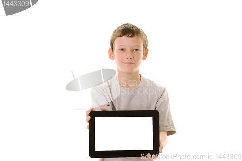 Image of Young boy holding tablet computer