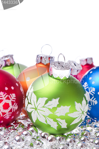 Image of christmas balls with snowflake symbols