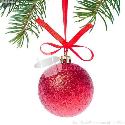 Image of red christmas ball hanging from tree