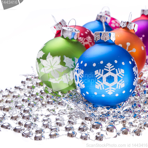 Image of christmas balls with snowflake symbols