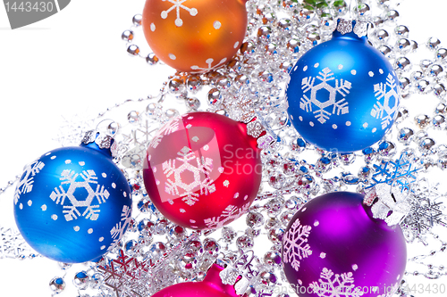 Image of christmas balls with snowflake symbols