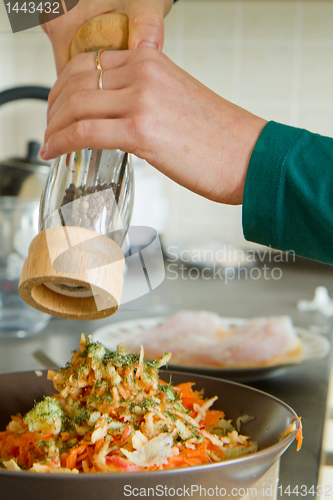Image of chef making salad