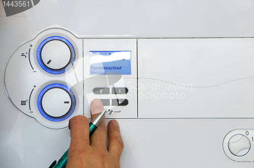 Image of plumber thermostat