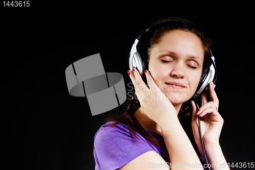 Image of smiling girl in the headphones