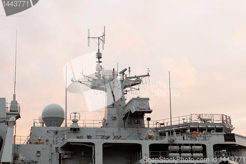 Image of Sunset behind Royal Navy warship