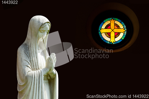 Image of Isolated statue of Mary with cross