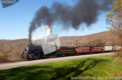 Image of WM Steam train powers along railway