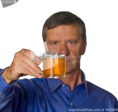 Image of Senior man with glass of beer