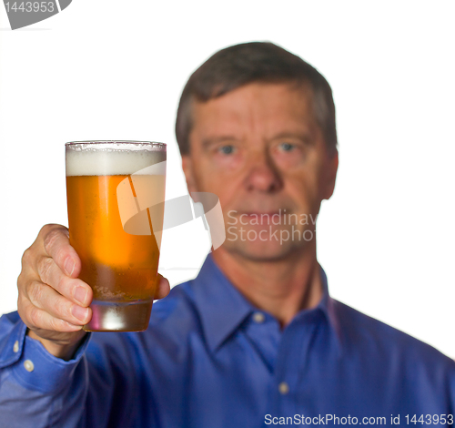 Image of Senior man with glass of beer