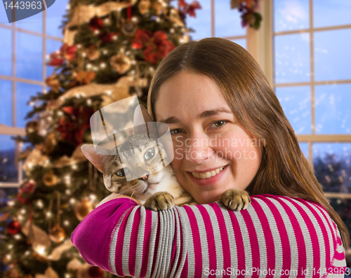 Image of Bengal cat on girls arm