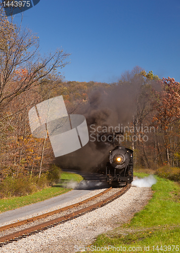 Image of WM Steam train powers along railway