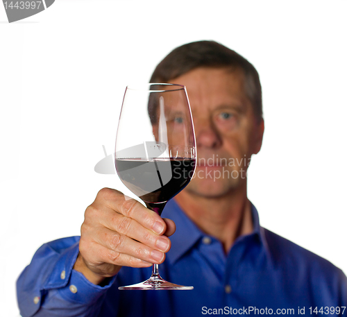 Image of Senior man with glass of red wine