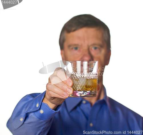 Image of Senior man with glass of whisky