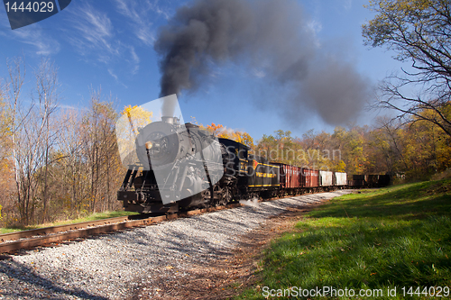 Image of WM Steam train powers along railway