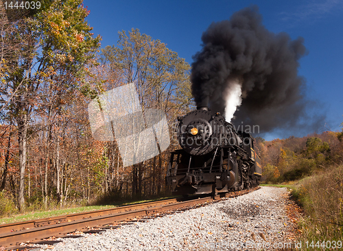 Image of WM Steam train powers along railway