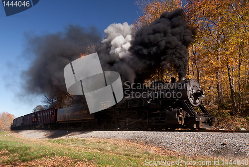 Image of WM Steam train powers along railway