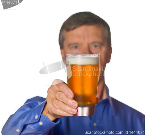 Image of Senior man with glass of beer