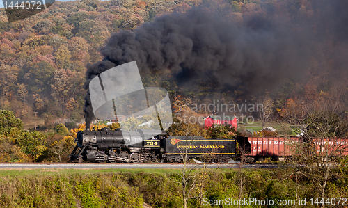 Image of WM Steam train powers along railway