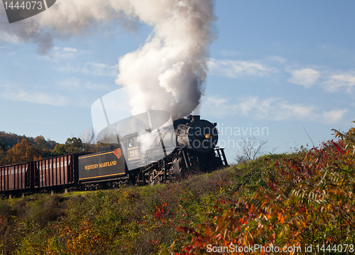 Image of WM Steam train powers along railway