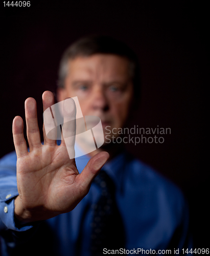 Image of Male executive touches sensor