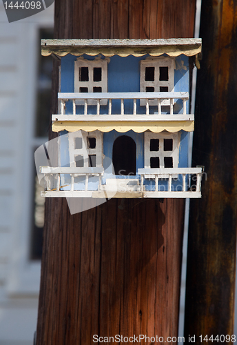 Image of Ornate blue bird house on pole