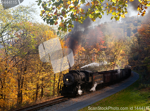 Image of WM Steam train powers along railway