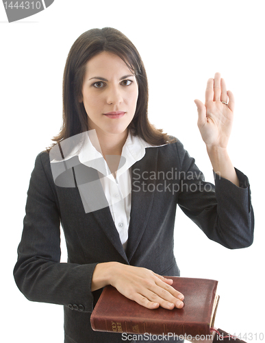 Image of Caucasian Woman Swearing on a Bible Isolated White Background