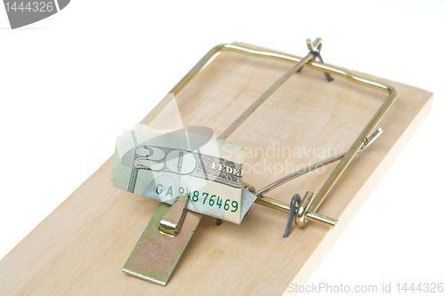 Image of Folded $20 Twenty Dollar Bill in Mousetrap, Isolated White Backg
