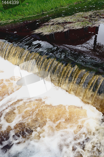 Image of River flow power. Little stair or waterfall down.