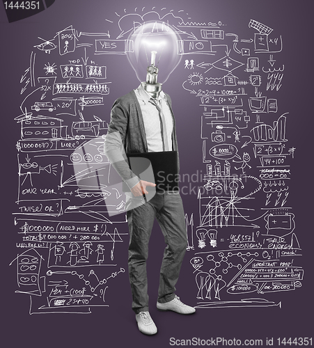 Image of lamp head businessman with laptop