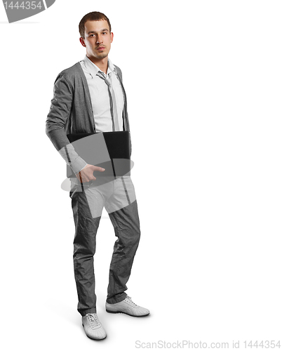 Image of male in with laptop in his hands