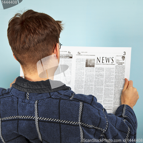 Image of Man reading the newspaper